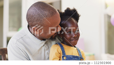 Mature African father, girl child and sitting together with care, love and bond with talk, love and smile in family home. Happy black man, kid and embrace with conversation, chat and relax on holiday Mature African father, girl child and sitting together with care, love and bond with talk, love and smile in family home. Happy black man, kid and embrace with conversation, chat and relax on holiday 112301900