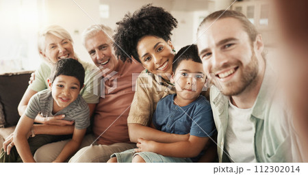 Selfie, happy and face of a big family in the living room relaxing, bonding and spending time together. Smile, love and portrait of boy children sitting with parents and grandparents at their home. 112302014