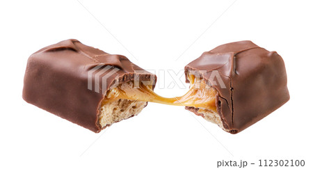 Chocolate bar with caramel and nuts broken in half flies close-up on a white background. Isolated Chocolate bar with caramel and nuts broken in half flies close-up on a white background. Isolated 112302100