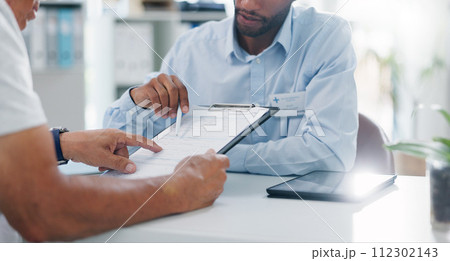 Man, doctor and hands with form in consultation for signature, application or health insurance at hospital. Closeup of person or medical employee explaining document or paperwork to patient at clinic 112302143