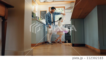 Support, love and ballet girl bonding with father in a kitchen together, excited and playing as a dancer pr ballerina. Tutu, dad and man dancing with kid with motivation or happiness in house or home 112302183