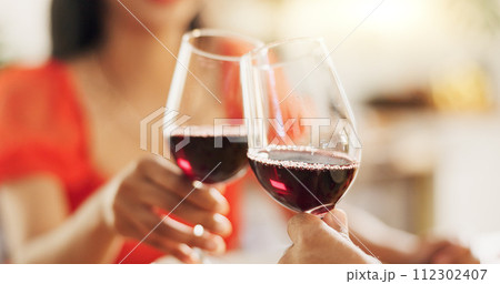 Couple, hands and toast with red wine for celebration of love, romance and valentines day on their anniversary. People or lover on date with glasses, drinks and alcohol for cheers, success and luxury 112302407