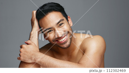 Face, cosmetics and Asian man with skincare, smile and dermatology on a grey studio background. Portrait, Japanese person and happy model with wellness, luxury treatment and beauty with aesthetic Face, cosmetics and Asian man with skincare, smile and dermatology on a grey studio background. Portrait, Japanese person and happy model with wellness, luxury treatment and beauty with aesthetic 112302469