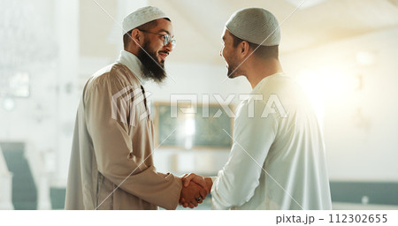 Muslim, handshake and people in mosque for greeting, conversation and respect in Islamic community. Worship, friends and men shaking hands in religious building for Ramadan Kareem, prayer and support Muslim, handshake and people in mosque for greeting, conversation and respect in Islamic community. Worship, friends and men shaking hands in religious building for Ramadan Kareem, prayer and support 112302655