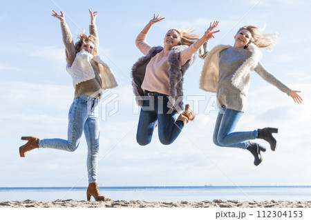 Three women jumping Three women jumping 112304153