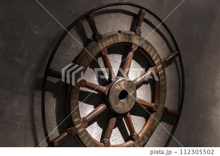 Vintage wooden steering wheel with brass details 112305502