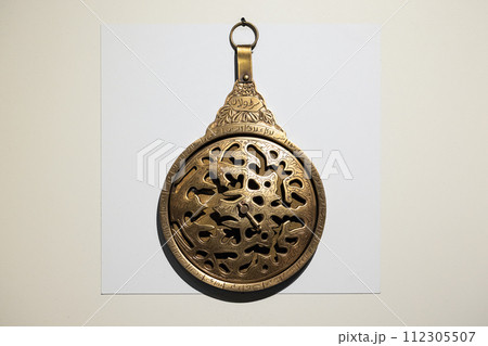 Antique Arabian astrolabe 18th-century is on white background 112305507
