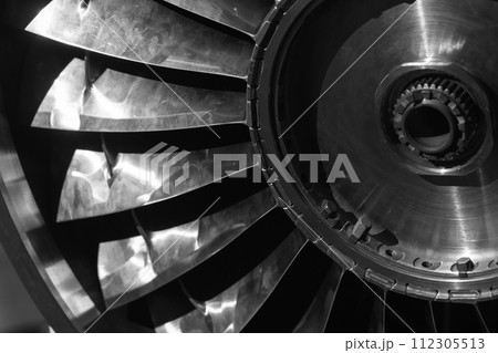 Turbine rotor. Turbojet engine close up black and white photo Turbine rotor. Turbojet engine close up black and white photo 112305513