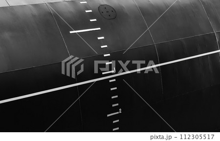 Black military submarine hull with waterline and draft scale 112305517
