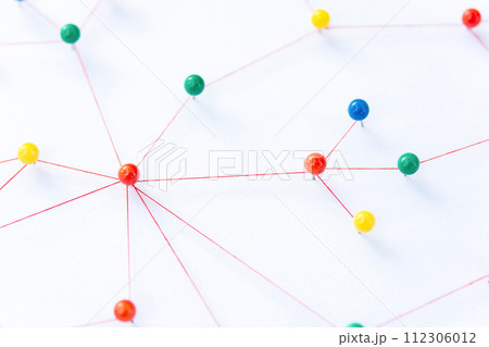 Linking entities, Blockchain, social media, Communications Network, The connection between the two networks. Network simulation on paper linked together by yarn Linking entities, Blockchain, social media, Communications Network, The connection between the two networks. Network simulation on paper linked together by yarn 112306012