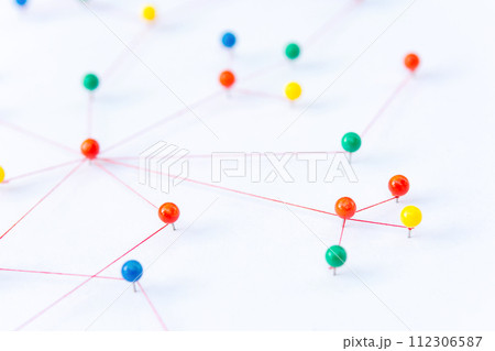 Linking entities, Blockchain, social media, Communications Network, The connection between the two networks. Network simulation on paper linked together by yarn Linking entities, Blockchain, social media, Communications Network, The connection between the two networks. Network simulation on paper linked together by yarn 112306587