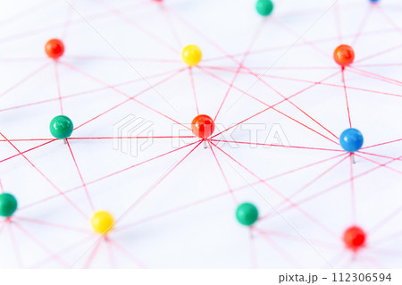 Linking entities, Blockchain, social media, Communications Network, The connection between the two networks. Network simulation on paper linked together by yarn Linking entities, Blockchain, social media, Communications Network, The connection between the two networks. Network simulation on paper linked together by yarn 112306594