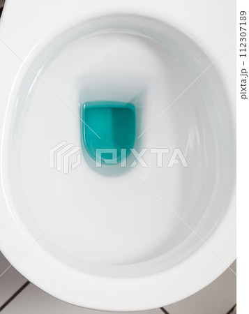 White toilet bowl with blue detergent White toilet bowl with blue detergent 112307189