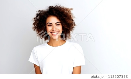 AI-generated content. Smiling young woman with curly brown hair in white t-shirt on gray background 112307558
