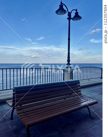 Benches and lampposts on the promenade by the sea at Sliema  Malta 112307804