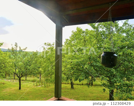 Wooden garden shed in a beautiful rural orchard. Close-up Wooden garden shed in a beautiful rural orchard. Close-up 112308429