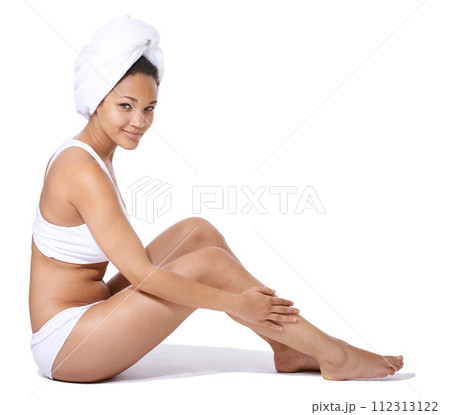 Happy woman, legs and skincare in studio portrait for hair removal results and beauty on floor on a white background. Young person or model in underwear with body cosmetics, dermatology and hygiene 112313122