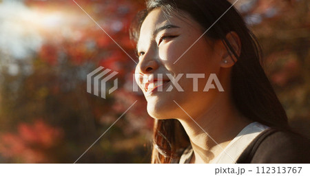 Outdoor, thinking and Asian woman with a smile, nature and forest with joy, daydreaming and holiday. Japanese person sunshine or girl with summer, travel or peace with vacation. calm or weekend break Outdoor, thinking and Asian woman with a smile, nature and forest with joy, daydreaming and holiday. Japanese person sunshine or girl with summer, travel or peace with vacation. calm or weekend break 112313767