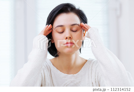 Face, anxiety or stress and woman in bedroom of home with depression, frustration or mental fatigue. Burnout, headache or insomnia with young person feeling annoyed, moody or unhappy in apartment Face, anxiety or stress and woman in bedroom of home with depression, frustration or mental fatigue. Burnout, headache or insomnia with young person feeling annoyed, moody or unhappy in apartment 112314152