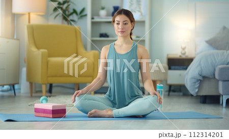 Exercise woman, yoga stretching and home fitness in living room floor for wellness, balance training and strong body. Healthy lady, pilates focus and flexible cobra workout training in house lounge 112314201