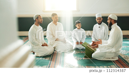 Muslim, religion and people in mosque for praying, religious education and worship or prayer. Islamic community, knowledge and men talking on carpet for Ramadan Kareem, learning Quran and Eid Mubarak Muslim, religion and people in mosque for praying, religious education and worship or prayer. Islamic community, knowledge and men talking on carpet for Ramadan Kareem, learning Quran and Eid Mubarak 112314387