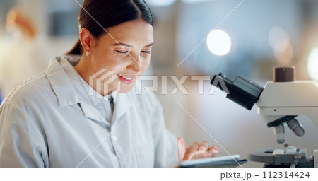 Scientist, woman and tablet, microscope or laboratory research for DNA analysis and happy with medical study. Student or science expert in biotechnology with digital software and lens check for data 112314424