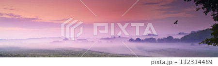 Drone, landscape and clouds in nature, sunset or peace in morning with countryside tranquility. Freedom, aerial view and sunrise outdoor for travel, explore or adventure, vacation or Amsterdam trip 112314489