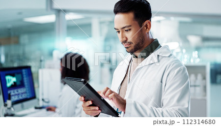 Scientist, man and tablet for laboratory research, DNA analysis and results in medical study at night. Young science expert or people in biotechnology, digital software or computer for test checklist Scientist, man and tablet for laboratory research, DNA analysis and results in medical study at night. Young science expert or people in biotechnology, digital software or computer for test checklist 112314680
