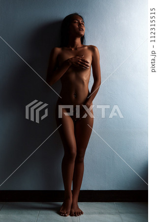 Asian nude sexy girl posing next to the wall 112315515