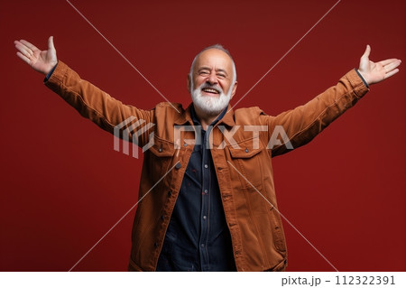 A man in a brown jacket is smiling and raising his arms 112322391