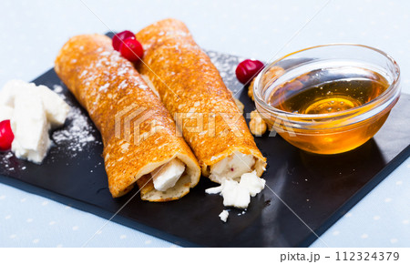 Bulgarian crepes Palatschinke on black board Bulgarian crepes Palatschinke on black board 112324379