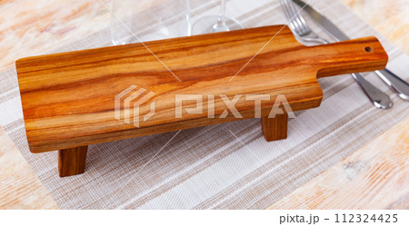 Empty natural wooden board for serving of breakfast 112324425