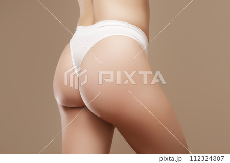 Real woman skin. Woman hips with visible stretch Real woman skin. Woman hips with visible stretch 112324807