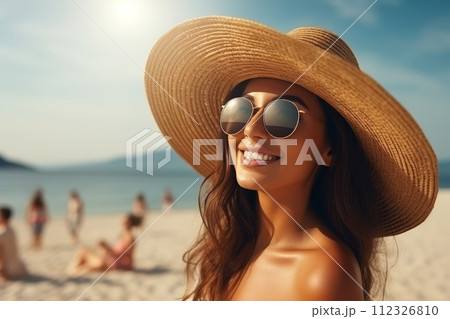Closeup portrait, beautiful woman in straw hat. In the summer on the nature of the tanned girl with long hair. 112326810