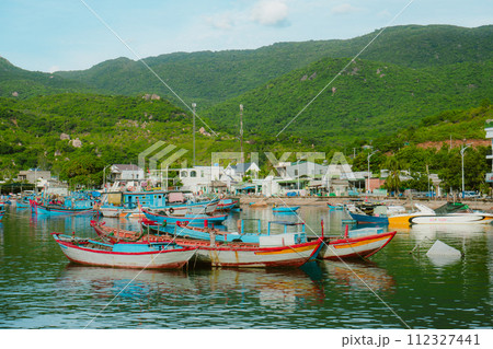 fishing boats on the shore, moored boats 112327441