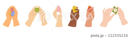 Collection with different hands that are holding easter painted eggs. 112335218