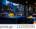 Twilight Taxi Service in City Center During Rush Hour Traffic 112335391