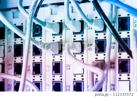 white patch cables connected to data switch 112335572