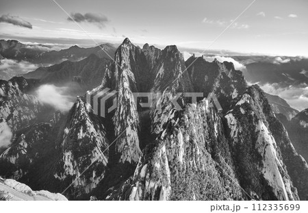 Black and white photo of Huashan National Park mountain landscape, China. Black and white photo of Huashan National Park mountain landscape, China. 112335699