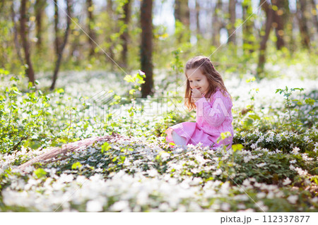 Kids with bunny ears on Easter egg hunt. Kids with bunny ears on Easter egg hunt. 112337877