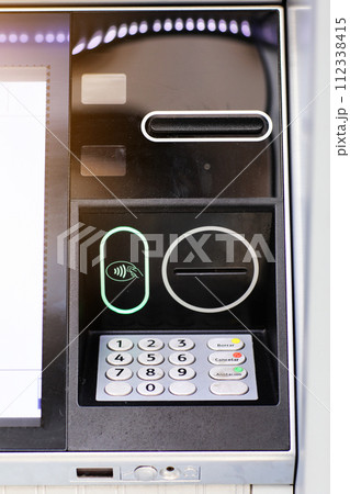 Automated teller machine details, ATM. Cashpoint keypad, NFC contactless wifi system, card reader and receipt printer. Finance, transactions, credit card, money withdrawal, currency, security banking Automated teller machine details, ATM. Cashpoint keypad, NFC contactless wifi system, card reader and receipt printer. Finance, transactions, credit card, money withdrawal, currency, security banking 112338415