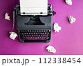 Vintage typewriter and crumpled paper sheets. Writer and blogger concept. Top view, flat lay 112338454