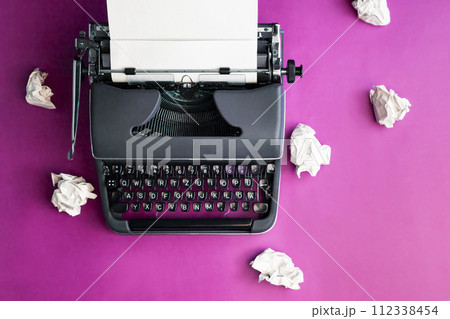 Vintage typewriter and crumpled paper sheets. Writer and blogger concept. Top view, flat lay 112338454