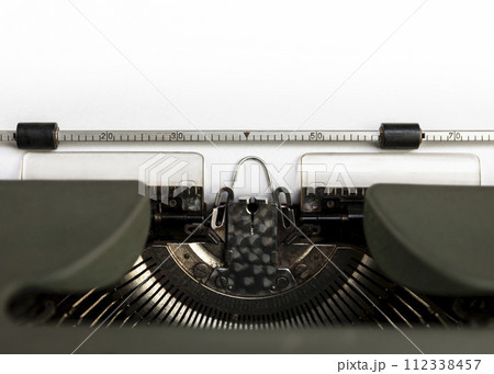 Vintage typewriter closeup. Blank paper sheet for copy space or add text 112338457