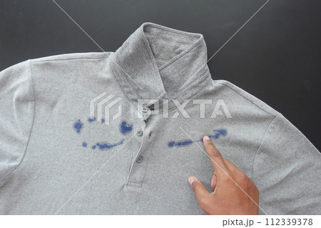 shirt with blue ink stain . 112339378