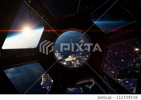 The night Earth from porthole on space station. 112339538