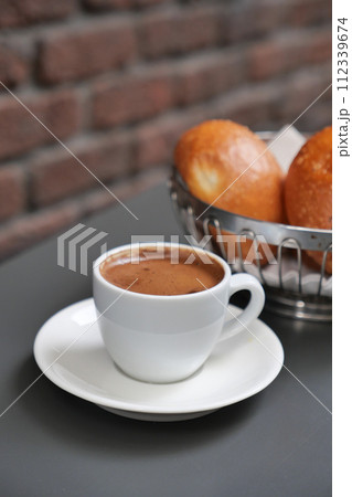 a cup of turkish coffee on table  112339674