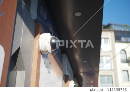 CCTV security camera operating on atm booth  112339758