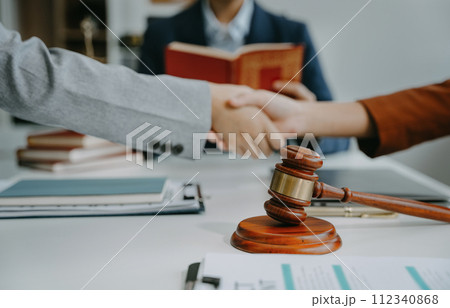 Successful team work lawyer victory shaking hands thumbs to show success and motivation. 112340868