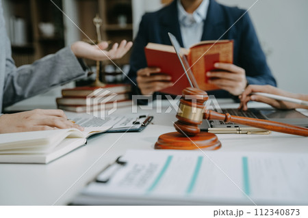 Businessman and Male lawyer or judge consult having team meeting with client, Law and Legal services concept in office. Businessman and Male lawyer or judge consult having team meeting with client, Law and Legal services concept in office. 112340873